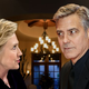 Clooney leans his right lapel closer to Clinton while telling her an anecdote about how he once emailed a screenplay to someone unauthorized to read it, before asking her if she’s ever done anything similar.
